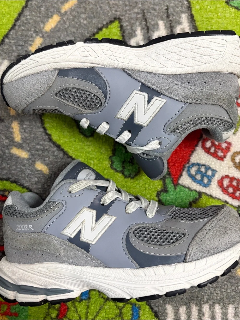 New Balance Kids Gray and White Sneakers
